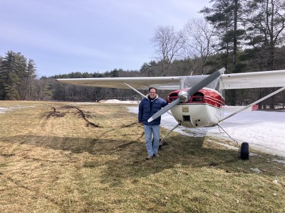 Nick standing with Cessna 170B N72C after extracting it from a muddy rut at Crow Island
